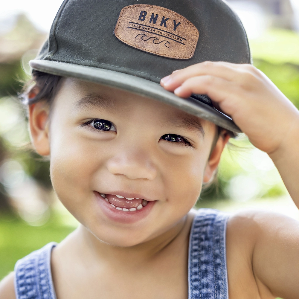 Little boy holding his hat - Commercial Photographer in Oahu, Hawaii.