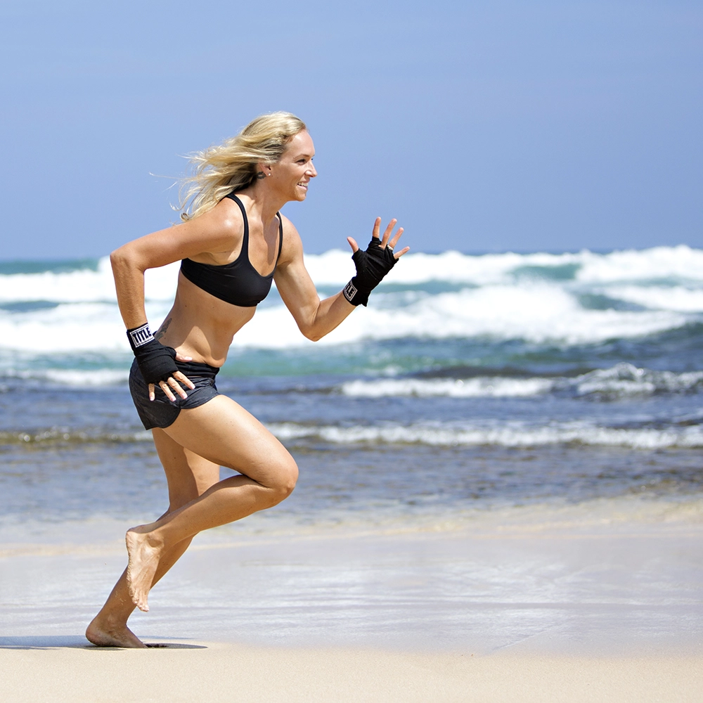 Woman running at the beach - Commercial Photographer in Waikiki, Hawaii.