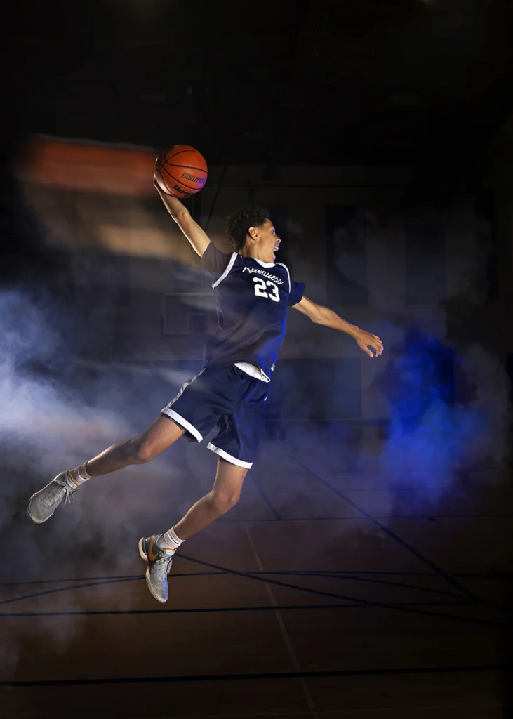 Sports Rock Media Photography: Basketball player shooting ball in hoop.