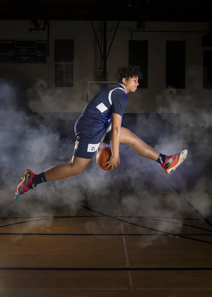 Sports Rock Media Photography: Basketball player showing his skills mid air.