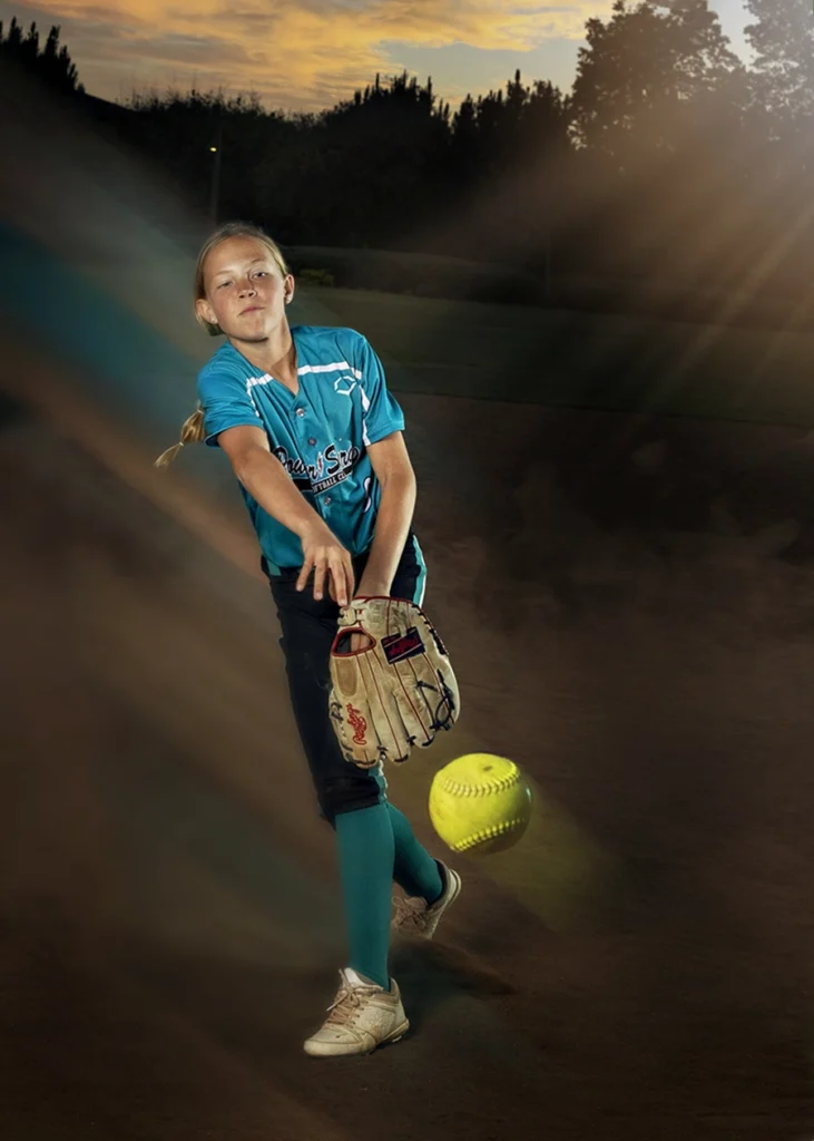 Sports Rock Media Photography: Young girl baseball player throwing the ball.