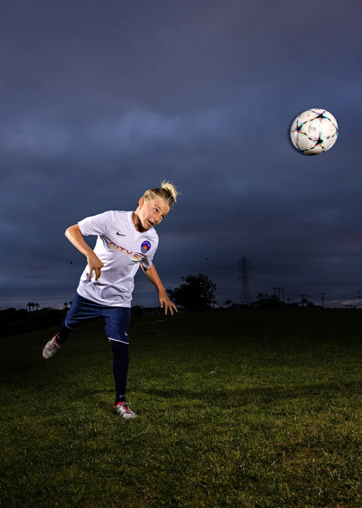 Sports Rock Media Photography: Soccer player passing soccer ball with his head.