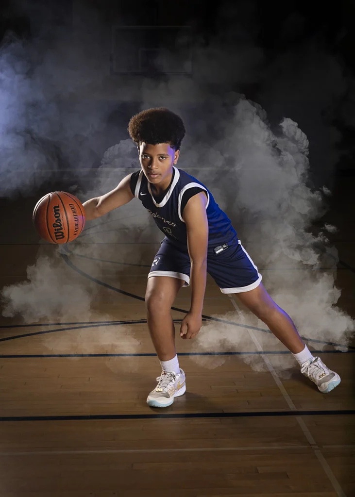 Sports Rock Media Photography: Basketball player dribbling the ball.