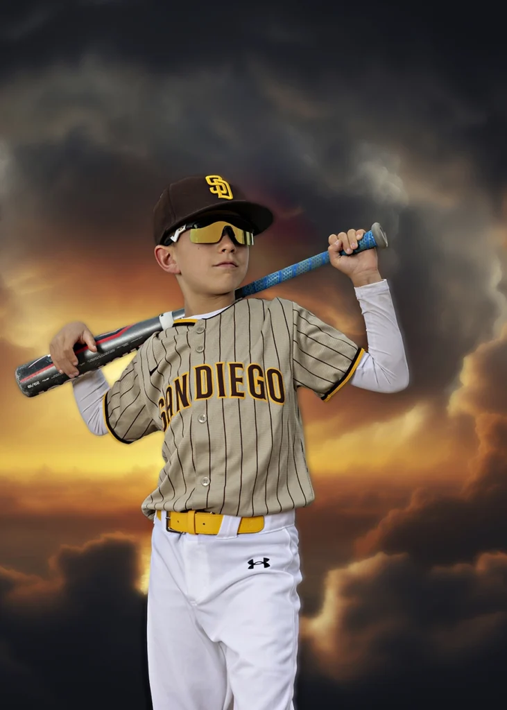 Sports Rock Media Photography: A young boy holding a baseball bat wearing shades.